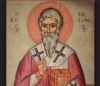 Ὁ &Mu;έ&gamma;&alpha;&sigmaf; &Beta;&alpha;&sigma;ί&lambda;&epsilon;&iota;&omicron;&sigmaf;, ὁ ἄ&gamma;&rho;&upsilon;&pi;&nu;&omicron;&sigmaf; Ἐ&pi;ί&sigma;&kappa;&omicron;&pi;&omicron;&sigmaf;, &kappa;&alpha;&tau;ά &tau;ῶ&nu; &alpha;ἱ&rho;έ&sigma;&epsilon;&omega;&nu;. &Gamma;&rho;ά&phi;&epsilon;&iota; ὁ &Phi;ώ&tau;&eta;&sigmaf; &Mu;&iota;&chi;&alpha;ή&lambda;, ἰ&alpha;&tau;&rho;ό&sigmaf;